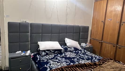 King size bed with dresing and side table and foam