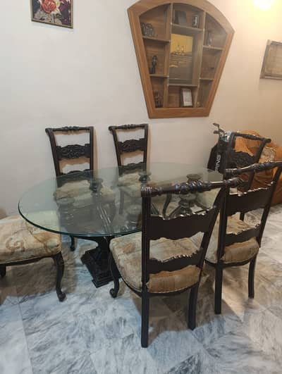 Glass dining table with chinyoti 6 chairs in very good condition