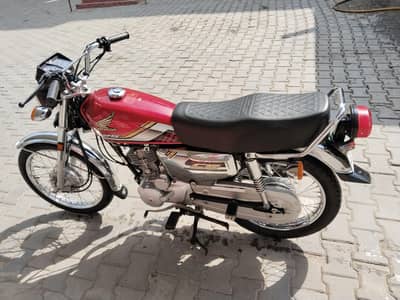 125 red colour new condition ha