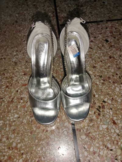 Silver High Heels in Excellent condition