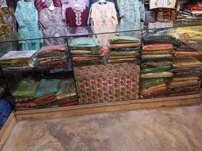 shishe ka counter ha garment clothes shop
