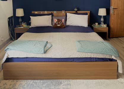 Bed with two bedside tables and Dressing table