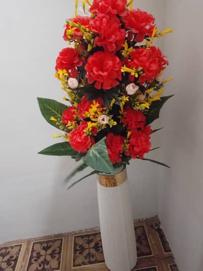 Beautiful artifical flower bouquet with long white vase