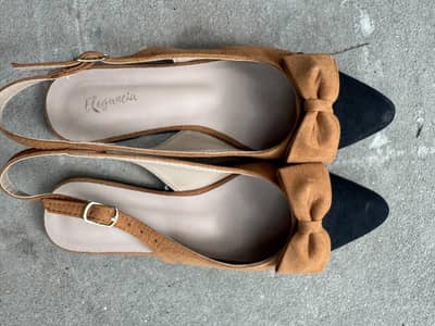 Black and brown pumps