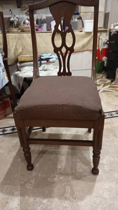 I am selling dinning table 8 chairs pure wood