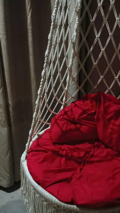 Beautiful Macrame Hanging Swing with Red Cushion – Rs. 12,000