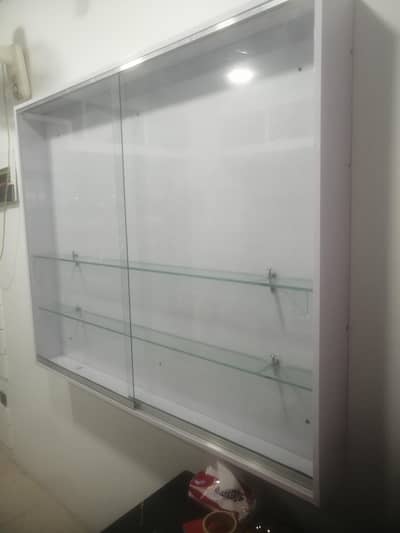 Glass and wood cabinet books and etc