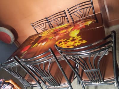 iron havey table and 6 chairs good condition