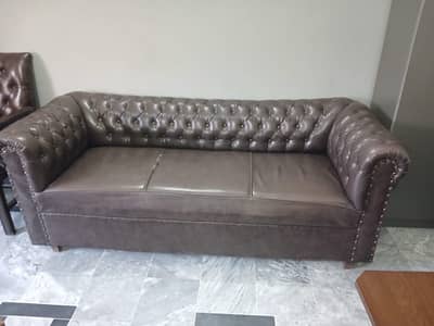 classic brown faux-leather Chesterfield