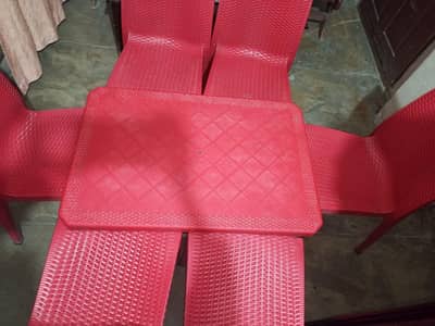 plastic table with 6 chairs