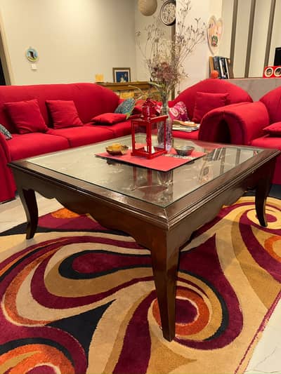 Glass top table made out of solid wood