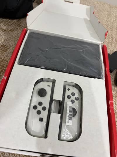 NINTENDO SWITCH OLED WITH GAMES AND ACCESSORIES