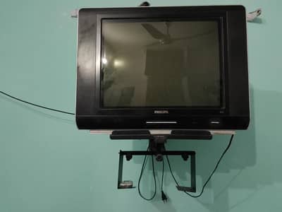 Philips real flat TV with rack, remote and cover.