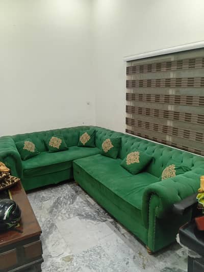 bottle green L shaped sofa with 6 cutions