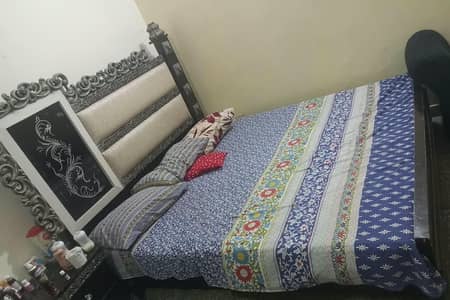 sold wood bed set with side tables and dressing table