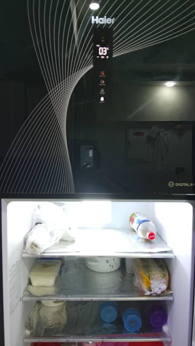 Refrigerator only 2 months used Haier 18 cubic feet black colour