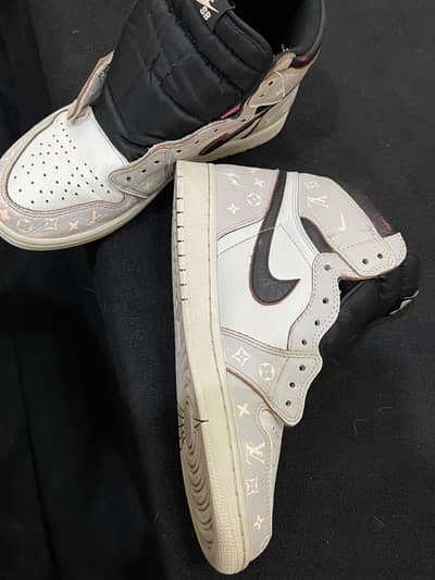 Nike Air Jordan 1 silhouette with a pink Louis Vuitton monogram print