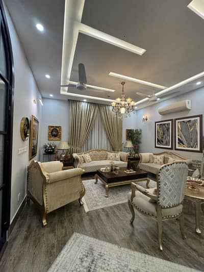 OWNER BUILT 1-KANAL ELEGANT BUT LIGHTLY USED ONLY ONE YEAR FULLY MAINTAINED SUPER HOT LOCATED BUNGALOW IS AVAILABLE IN THE T BLOCK OF DHA PHASE 7 LAHORE