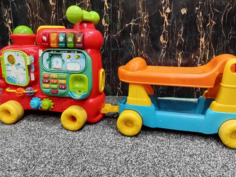 V Tech Push Walker Ride on 2