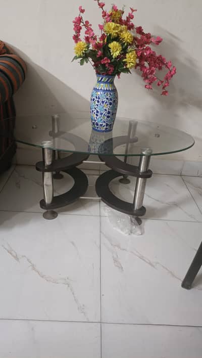 Slightly used center tables with glass top