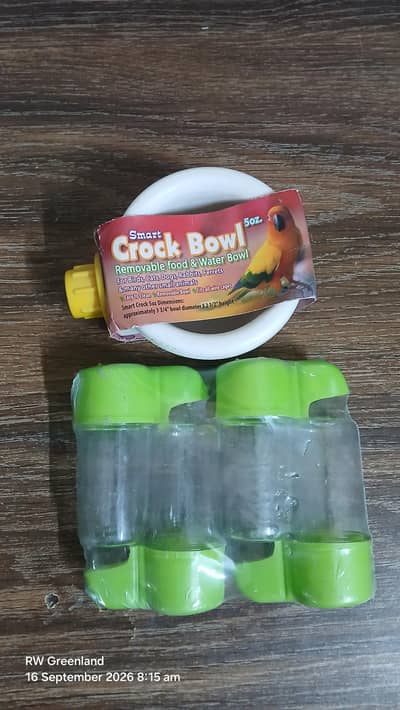 Bird food bowl and four water drinkers