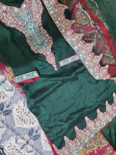 bottle green net dress with red hand work