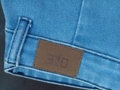 Beige pents OnE brand