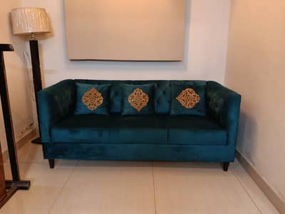 New 5 seater sofa set in teal blue color with a couch.