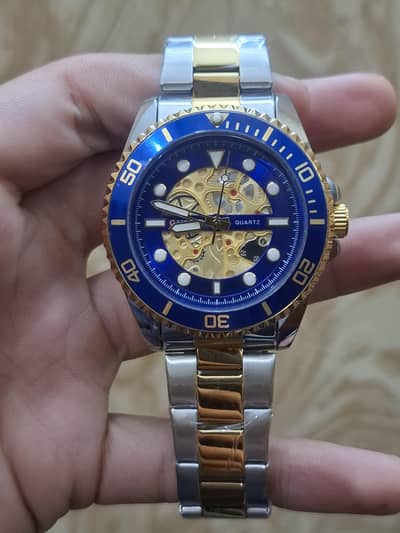 Curren blue diel watch in golden strap
