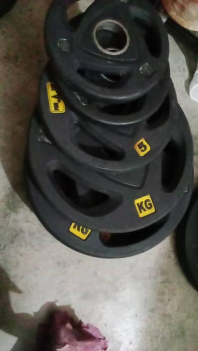 Olympic tri-grip weight plates or