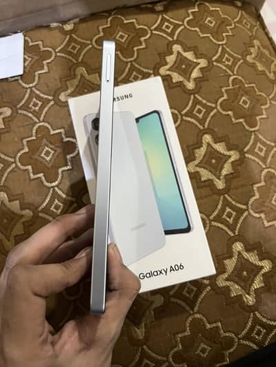 Samsung Mobile A06 4gb 64gb with box hai only one month use kia