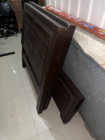 2 wooden single beds