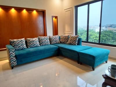 Green velvet L shaped sofa