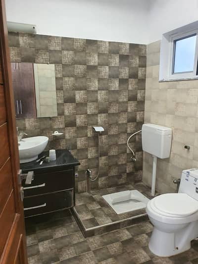 20marla 3beds DD TV lounge kitchen attached baths Brand New basement portion for rent in G 13 4 islamabad