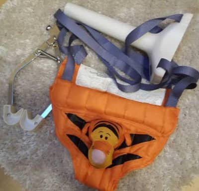 Baby door jumper or doorway bouncer. Disney character.