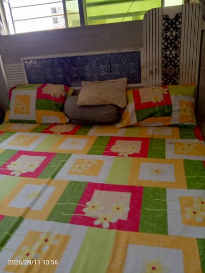 king size bed with 2 side tables and dressing table
