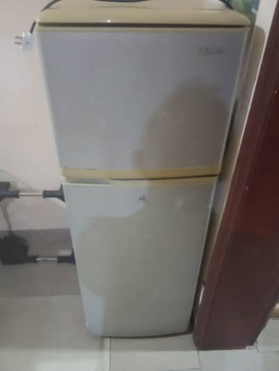 Haier Double door fridge with stand.
