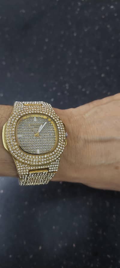 patik Philip watch with date. diamond