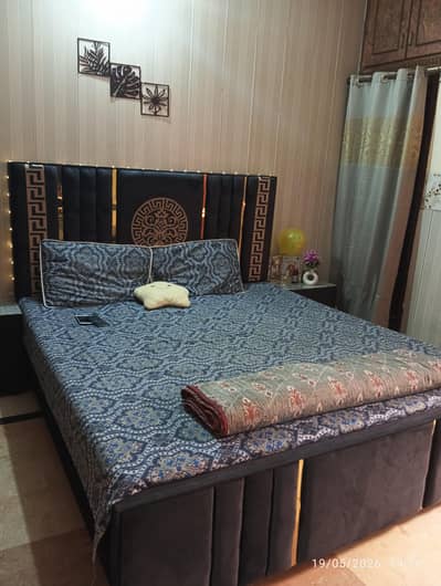 double bed with 2 side table and dressing