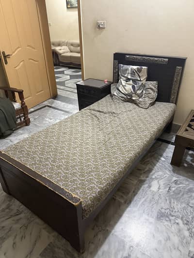 pair of two single beds with mattress