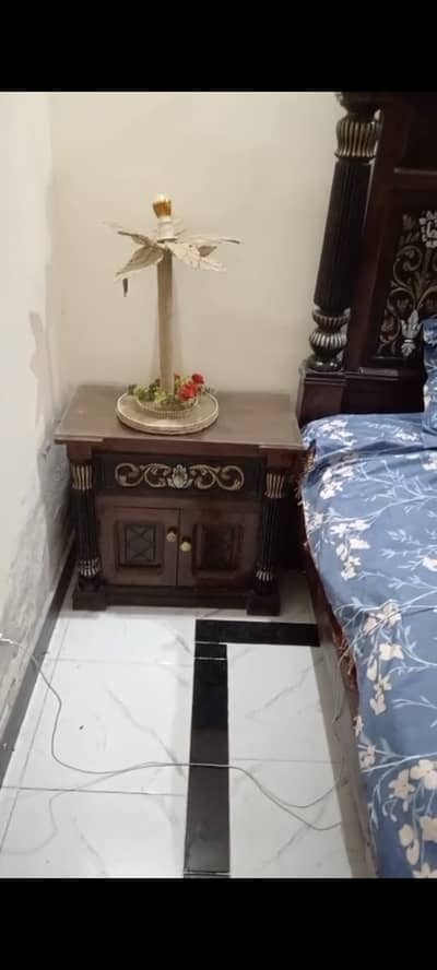 Bed with side tables and dresser and fancy mirror