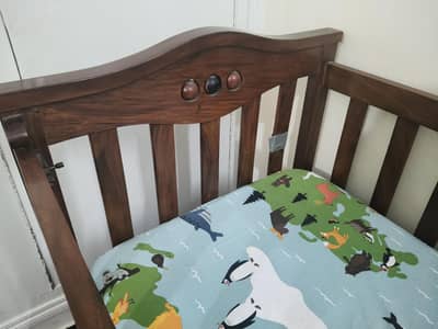 Solid wood adjustable baby cot