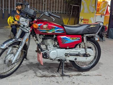 in red colour 2024 model 10/8 condition 9 hazar chlai hai takriban