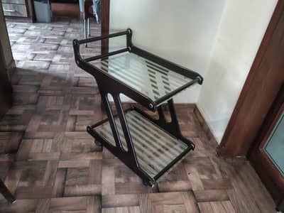 A two tier glass top wooden Tea Trolly