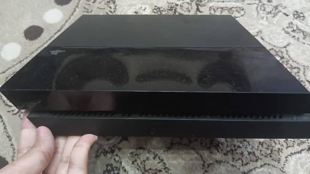 PS4 with two controllers two CDs 1