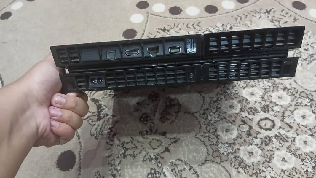 PS4 with two controllers two CDs 2