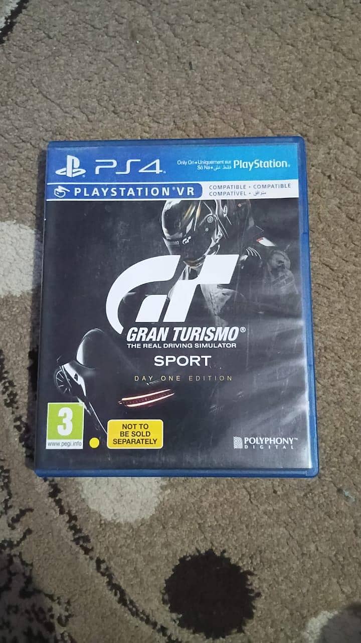 PS4 with two controllers two CDs 6
