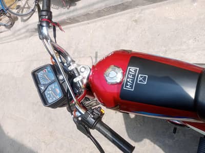 in red colour 2024 model 10/10 condition ha