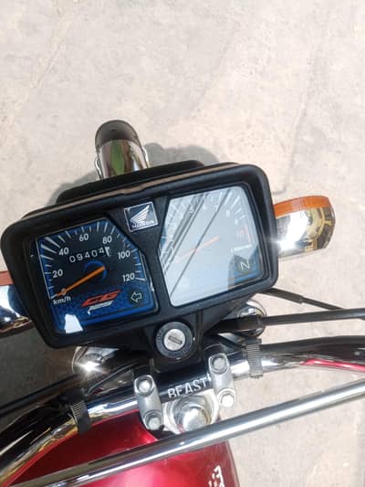 in red colour 2024 model 10/10 condition ha