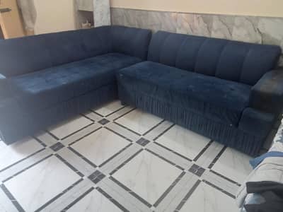 L shape sofa in blue color
